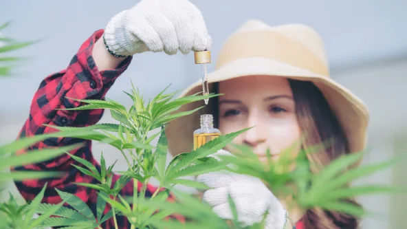 Women Using dropper to use THC-M Product